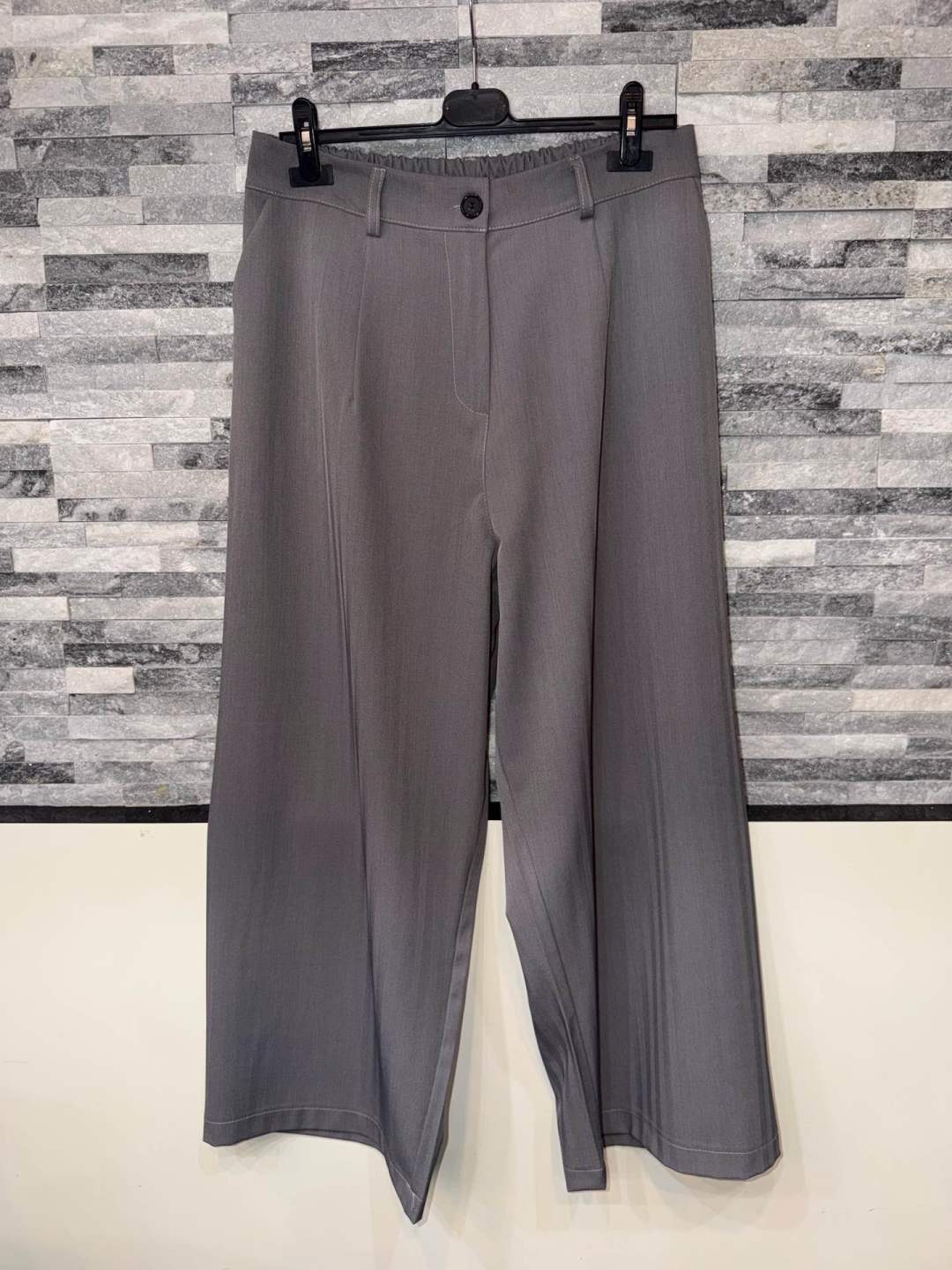 Wide‑Leg Pleated Trousers